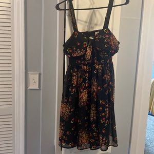 Mini summer dress very good co diction. Open back with peek a boo hole